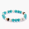 Turquoise pearl and tigers eye charm bracelet 17cm